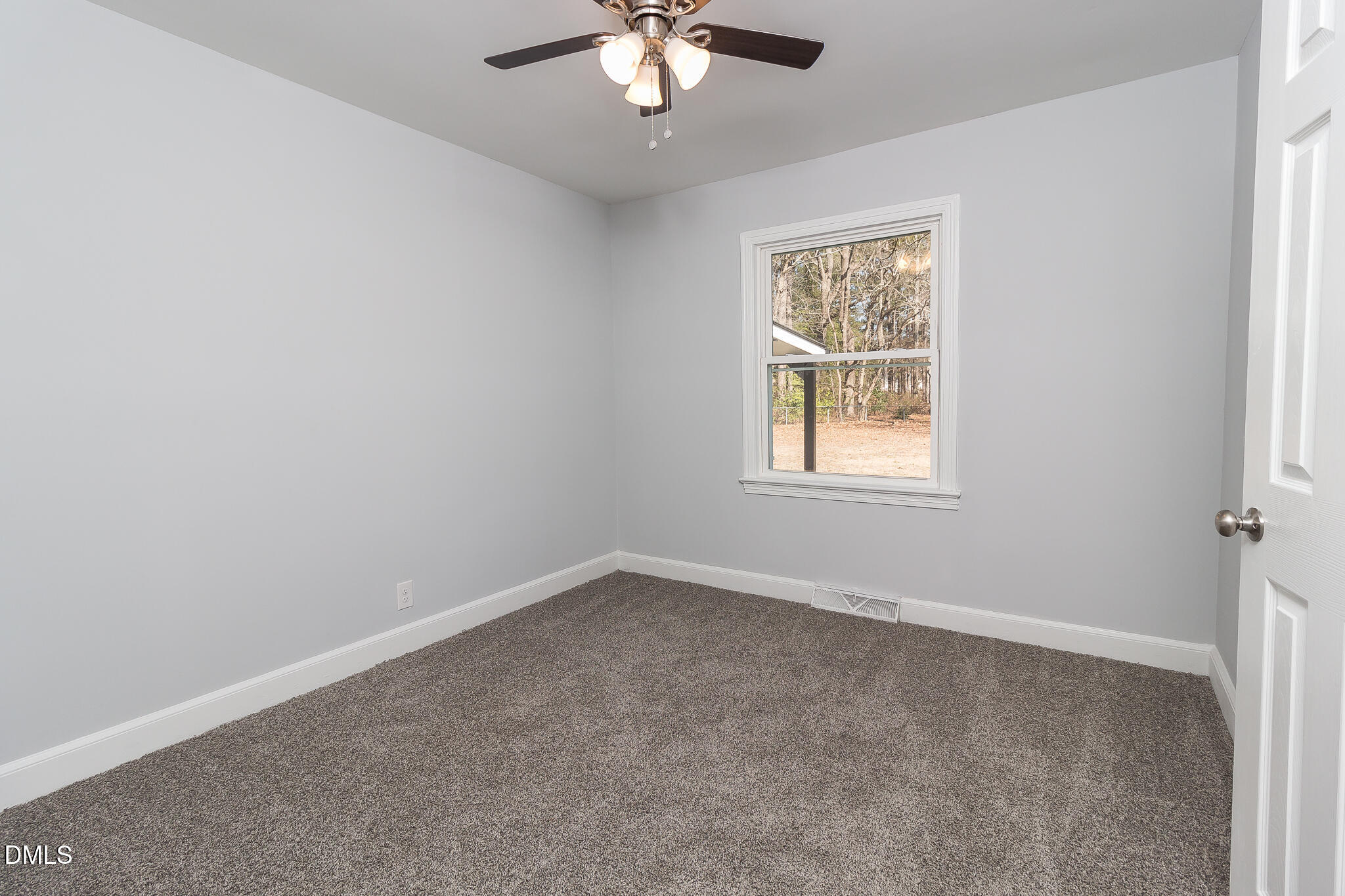 107 East New Hope Road Goldsboro, NC 27534 - Photo 21 of 33 an empty room with chandelier fan and windows