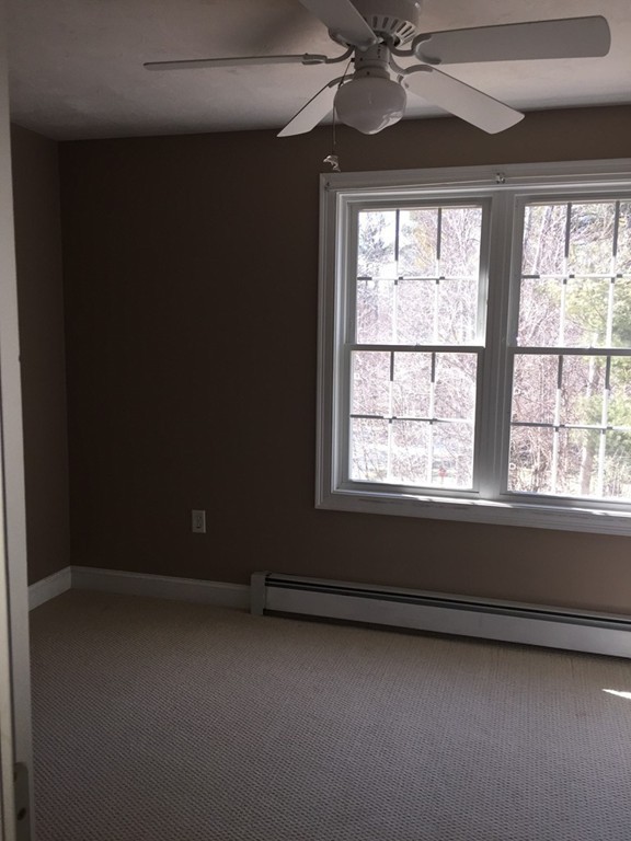 21 Winifreds Way Rutland, MA 01543 - Photo 12 of 15 a view of an empty room with a window