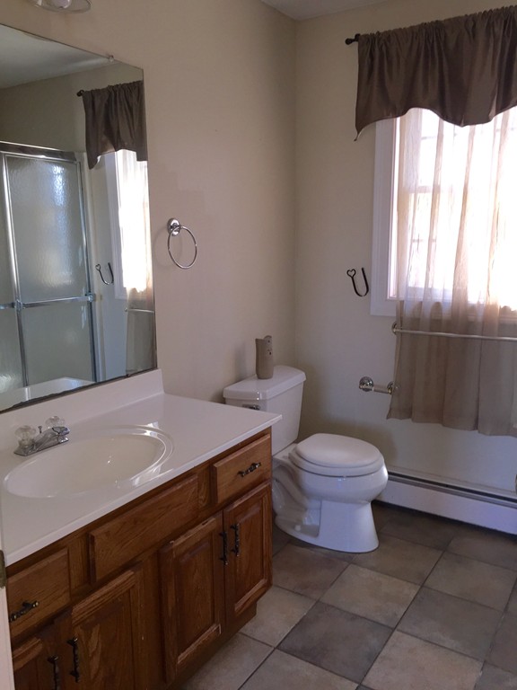 21 Winifreds Way Rutland, MA 01543 - Photo 14 of 15 a bathroom with a sink a toilet and window