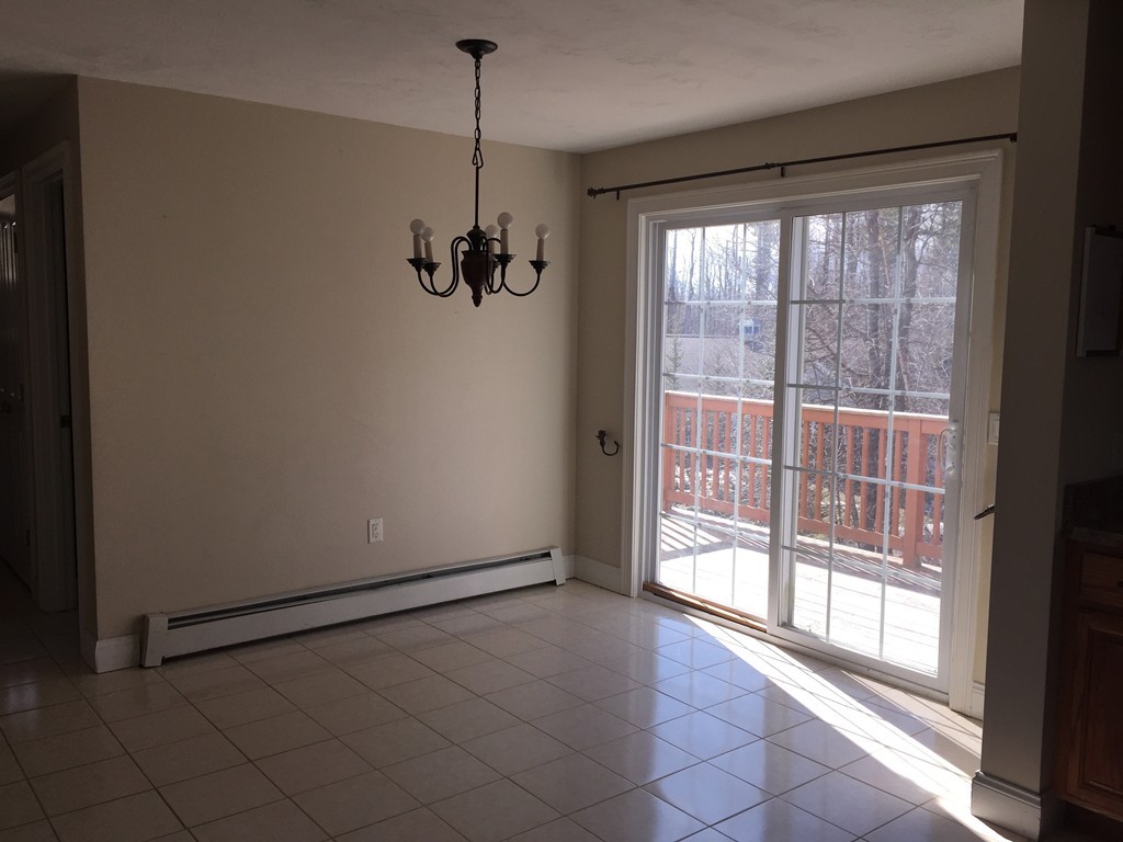 21 Winifreds Way Rutland, MA 01543 - Photo 4 of 15 a view of empty room with windows