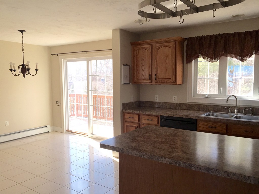21 Winifreds Way Rutland, MA 01543 - Photo 5 of 15 a kitchen with stainless steel appliances granite countertop a stove a sink and a microwave