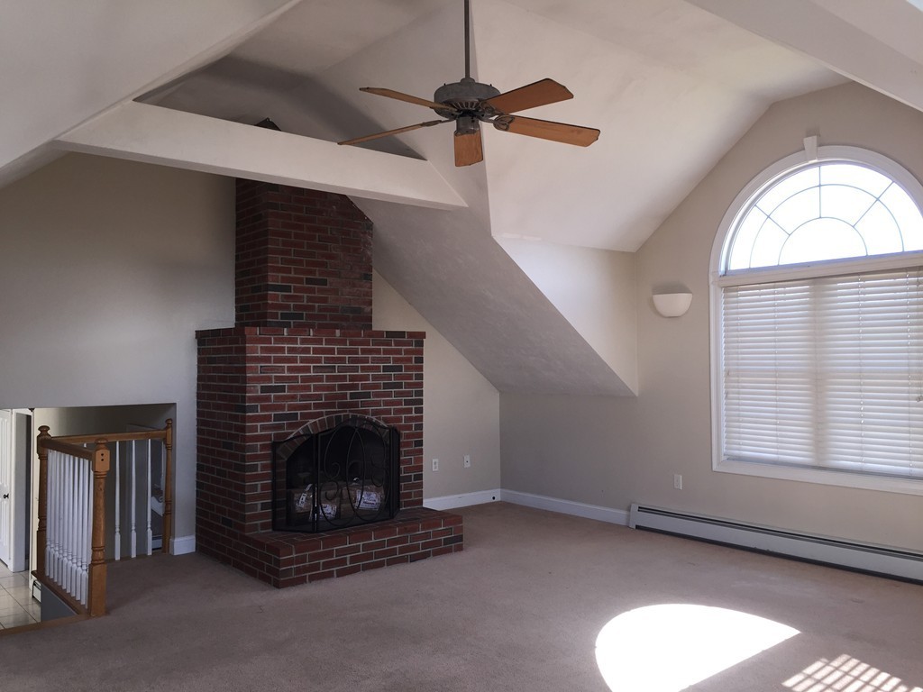 21 Winifreds Way Rutland, MA 01543 - Photo 7 of 15 a living room with furniture and a fireplace
