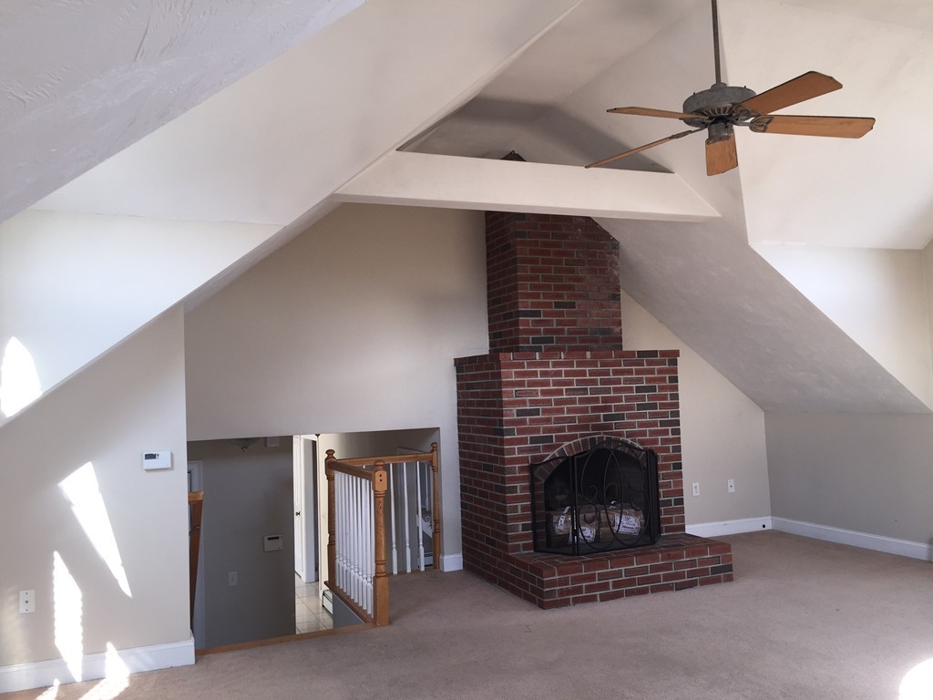 21 Winifreds Way Rutland, MA 01543 - Photo 8 of 15 a living room with furniture and a fireplace