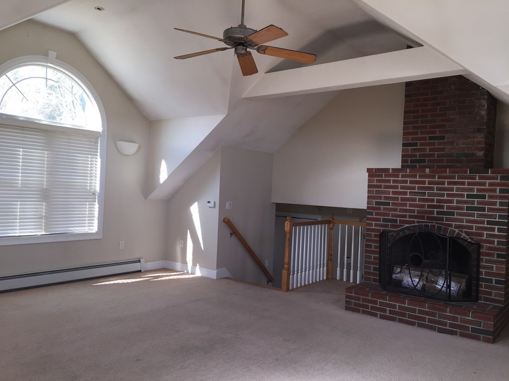 21 Winifreds Way Rutland, MA 01543 - Photo 9 of 15 a living room with a fireplace in it