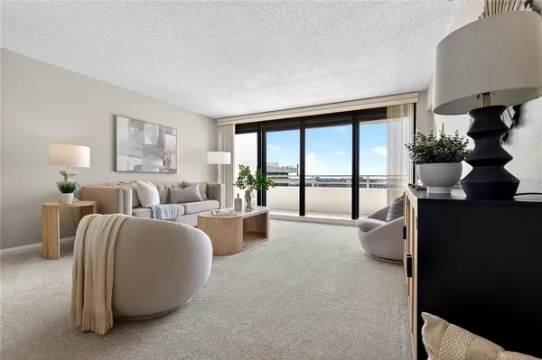 a bedroom with a bed and a potted plant