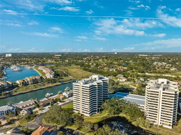 an aerial view of city and lake
