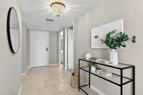 a view of entryway with a chandelier