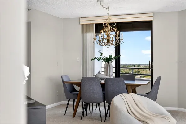a view of a dining room with furniture window and outside view