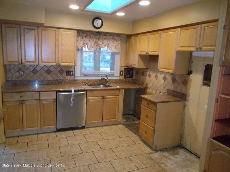 1 Sarno Street Colonia, NJ 07067 - Photo 9 of 30 a kitchen with a sink cabinets and window