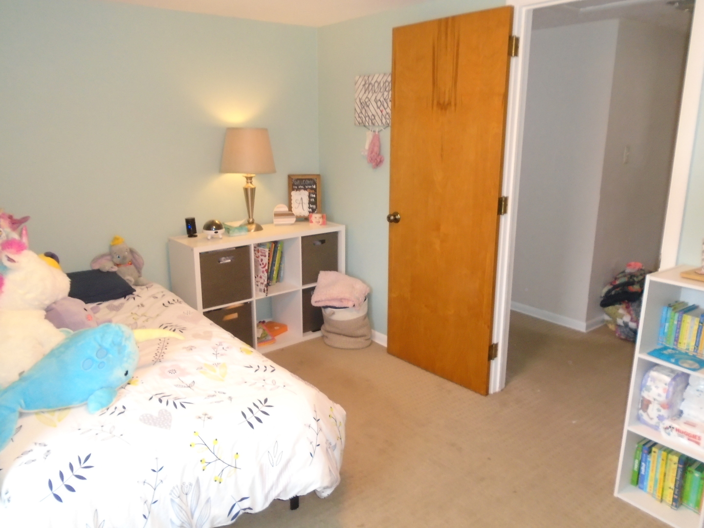 1221 7th Avenue Rochelle, IL 61068 - Photo 16 of 20 a bedroom with a bed and a table in it