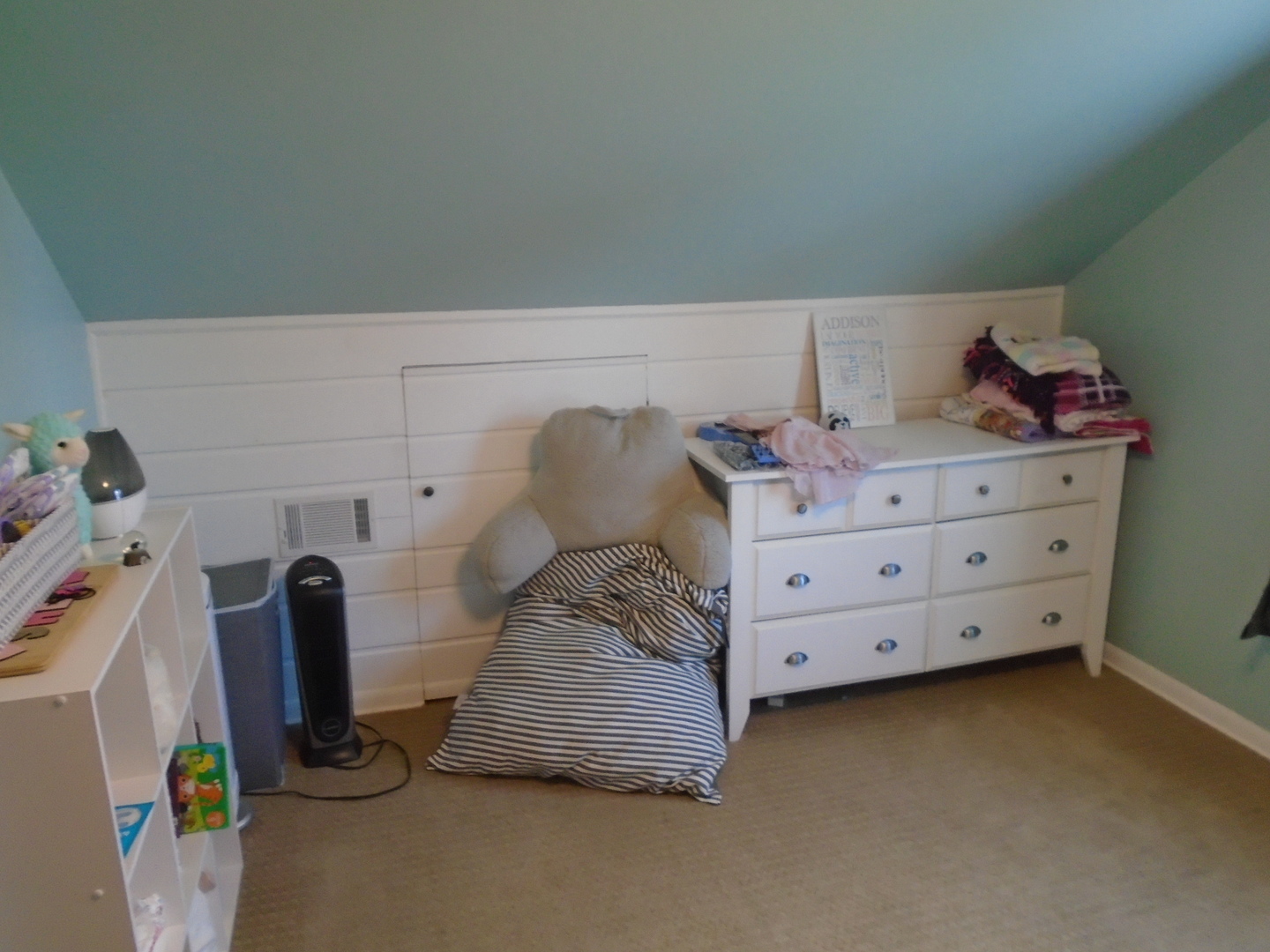 1221 7th Avenue Rochelle, IL 61068 - Photo 17 of 20 a bedroom with a bed and cabinets