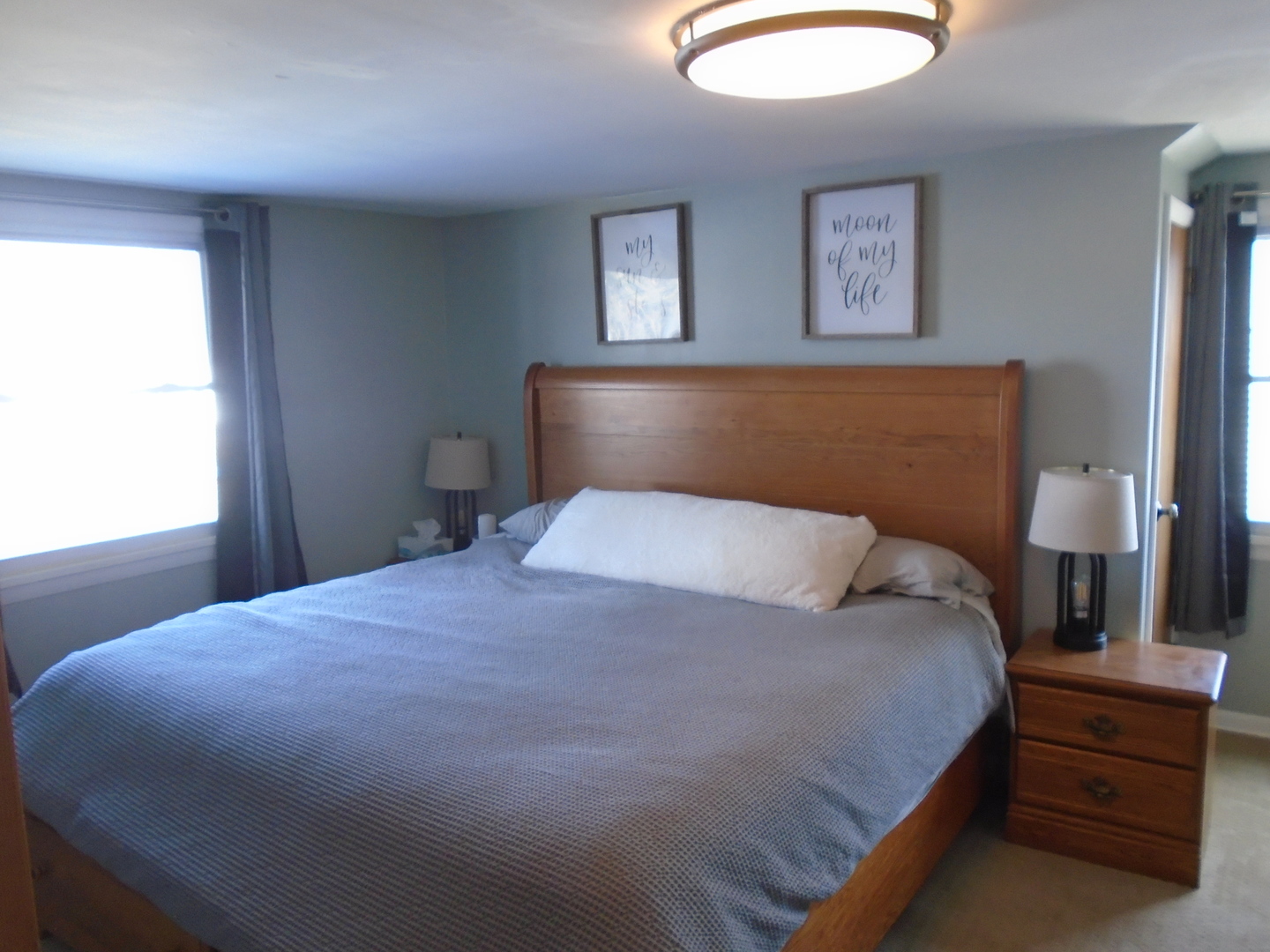 1221 7th Avenue Rochelle, IL 61068 - Photo 18 of 20 a bedroom with a bed and a lamp