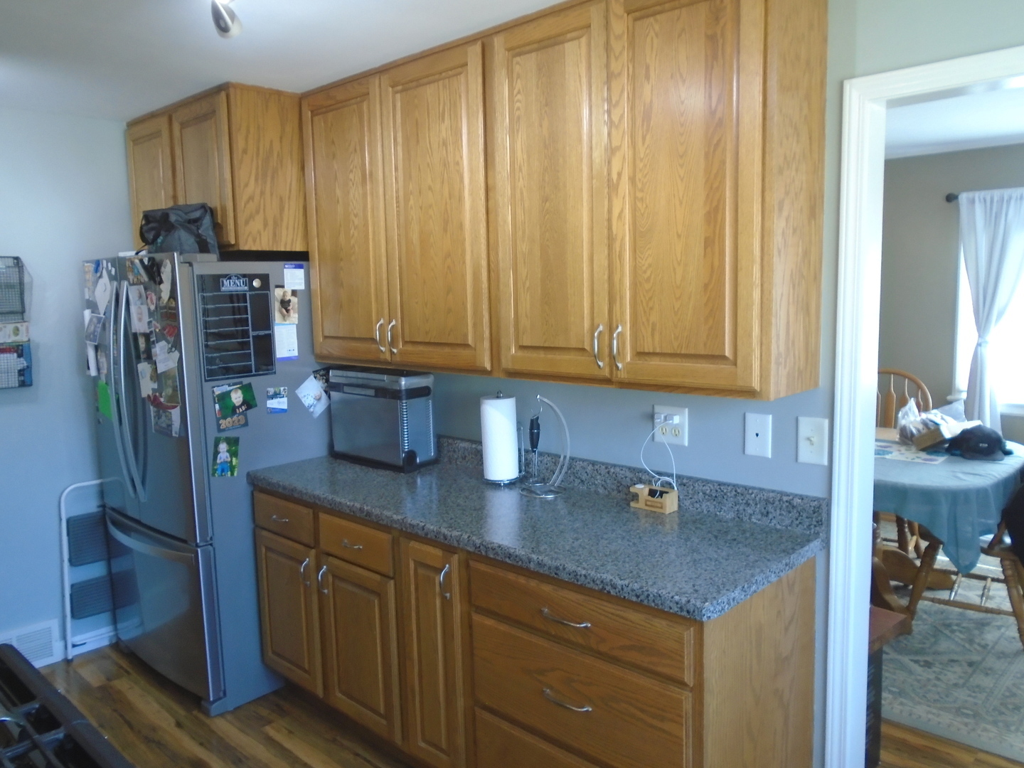 1221 7th Avenue Rochelle, IL 61068 - Photo 9 of 20 a kitchen with stainless steel appliances granite countertop a refrigerator and a sink