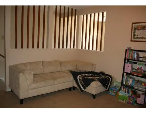 a living room with furniture a book shelf