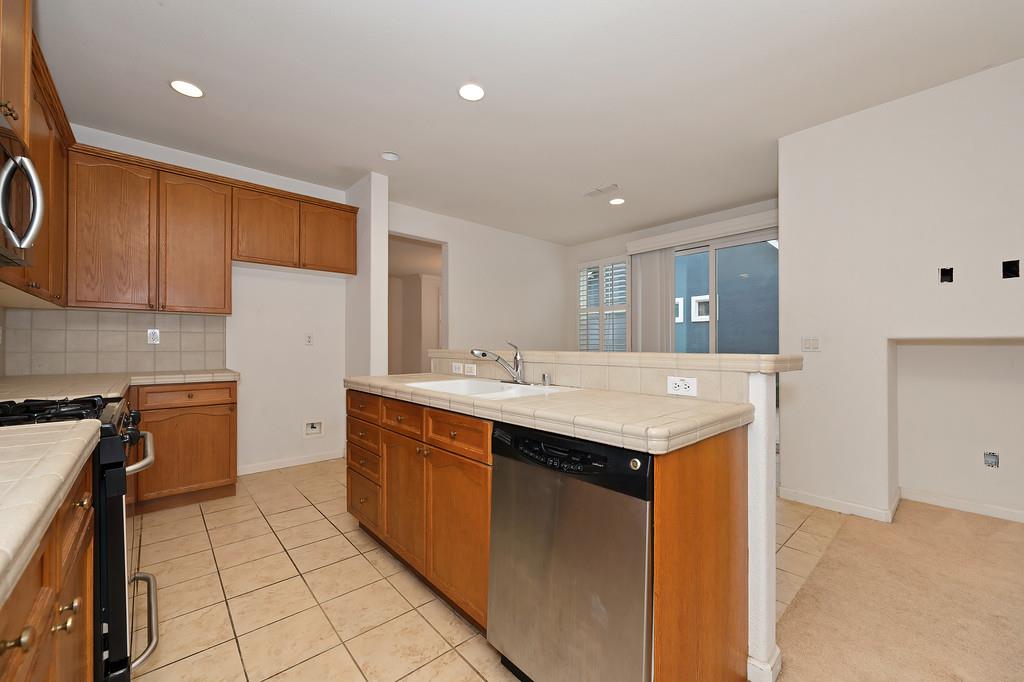 3505 Husch Way Rancho Cordova, CA 95670 - Photo 12 of 37 a kitchen with a sink appliances and cabinets