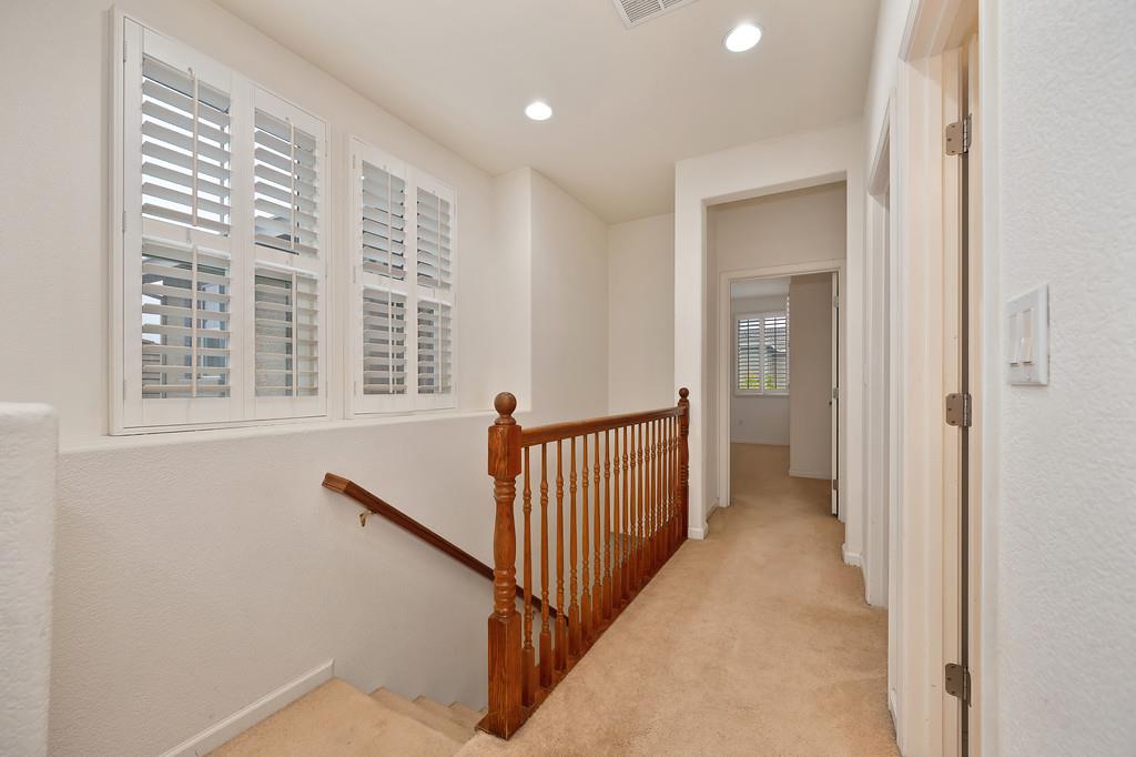 3505 Husch Way Rancho Cordova, CA 95670 - Photo 19 of 37 a view of a hallway with windows and stairs