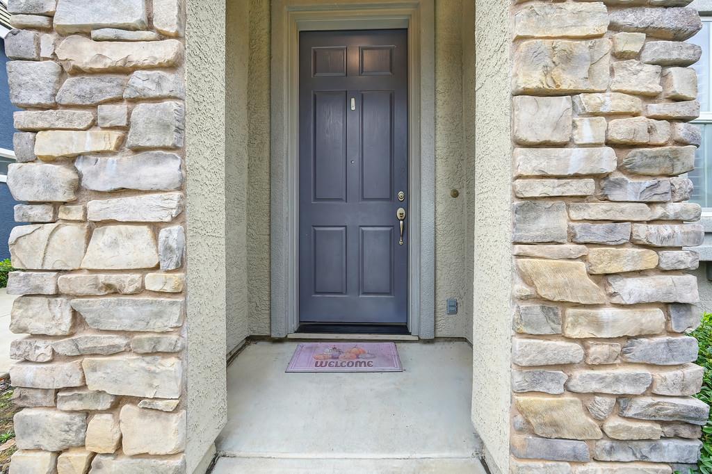 3505 Husch Way Rancho Cordova, CA 95670 - Photo 2 of 37 a view of a wooden door with a chair