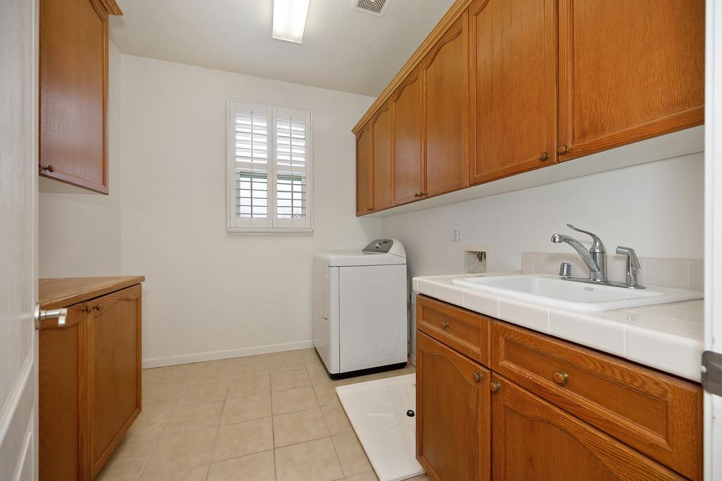 3505 Husch Way Rancho Cordova, CA 95670 - Photo 21 of 37 a utility room with sink dryer and washer