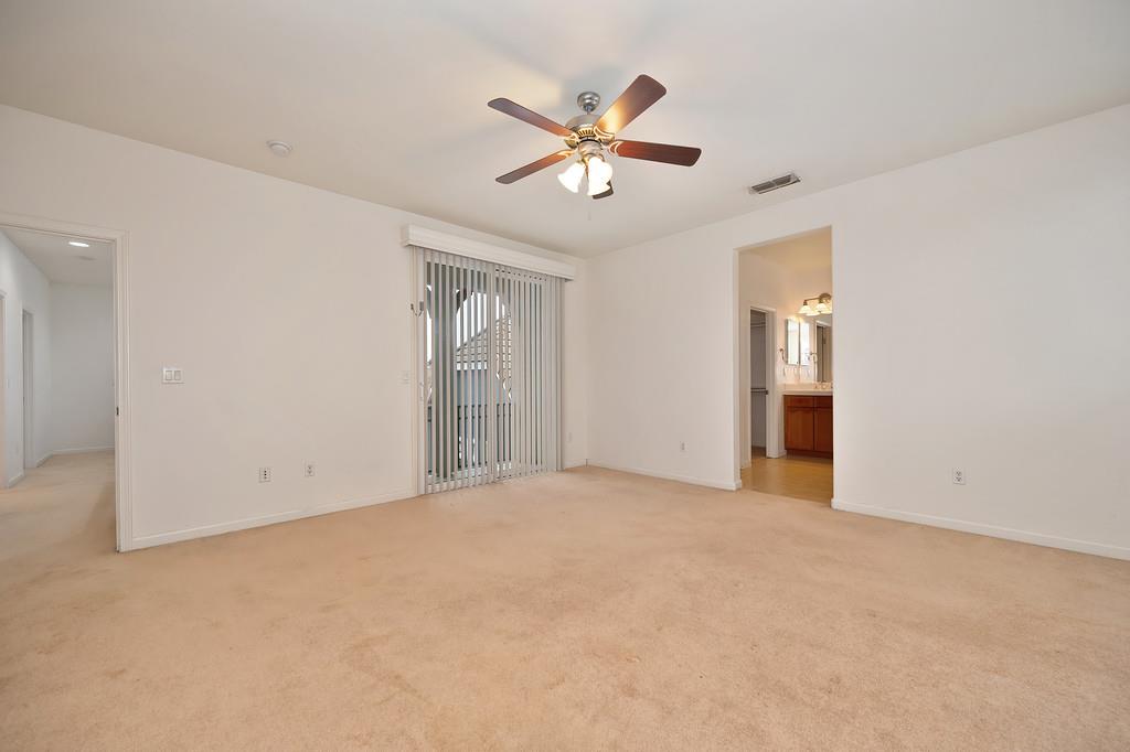 3505 Husch Way Rancho Cordova, CA 95670 - Photo 28 of 37 a view of an empty room with chandelier fan and a window
