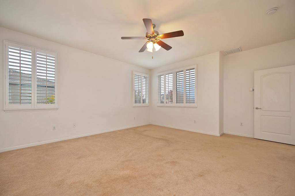 3505 Husch Way Rancho Cordova, CA 95670 - Photo 30 of 37 an empty room with windows and fan
