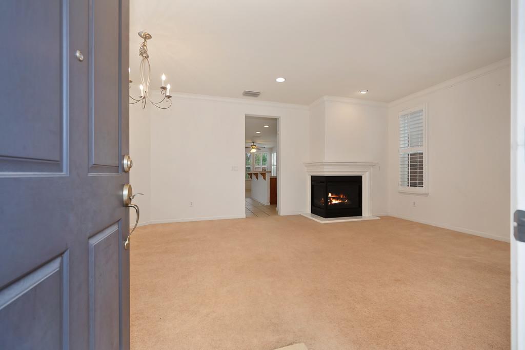 3505 Husch Way Rancho Cordova, CA 95670 - Photo 3 of 37 a view of an empty room with a fireplace and a window