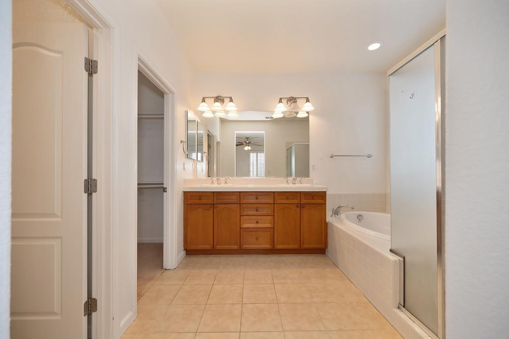 3505 Husch Way Rancho Cordova, CA 95670 - Photo 31 of 37 a large bathroom with a large tub and sink