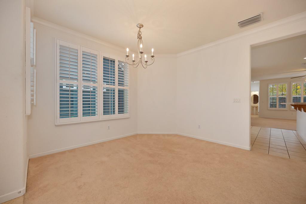 3505 Husch Way Rancho Cordova, CA 95670 - Photo 4 of 37 en empty room with windows and ceiling fan