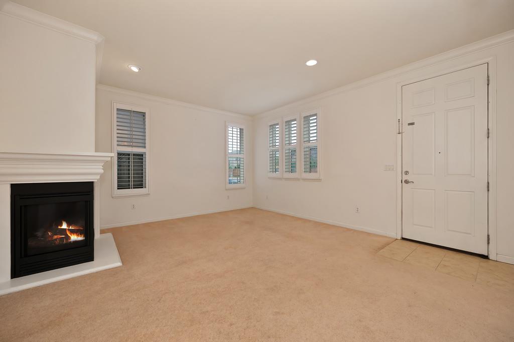 3505 Husch Way Rancho Cordova, CA 95670 - Photo 6 of 37 a view of an empty room with a window and fireplace
