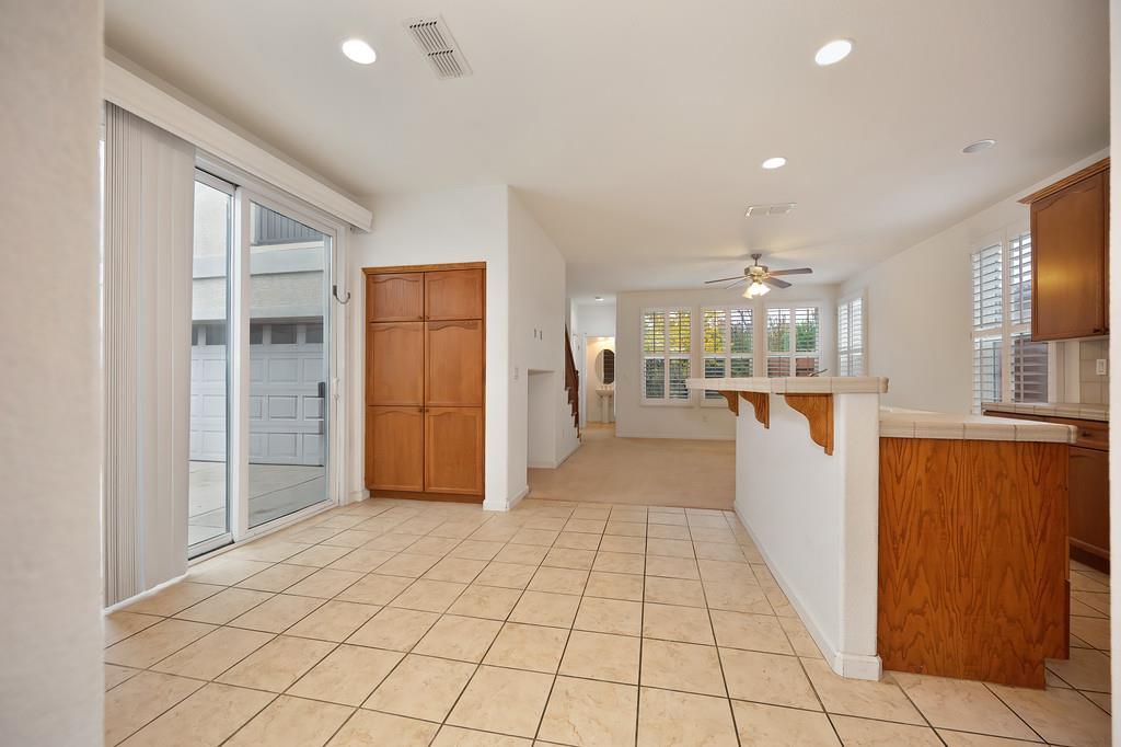 3505 Husch Way Rancho Cordova, CA 95670 - Photo 8 of 37 a view of a kitchen with a sink and a refrigerator