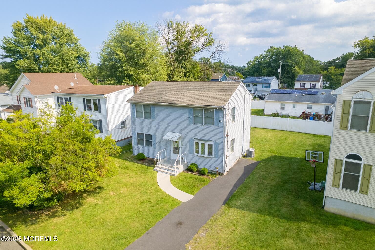207 Delaware Avenue Cliffwood, NJ 07721 - Photo 1 of 22 a aerial view of a house with swimming pool and furniture