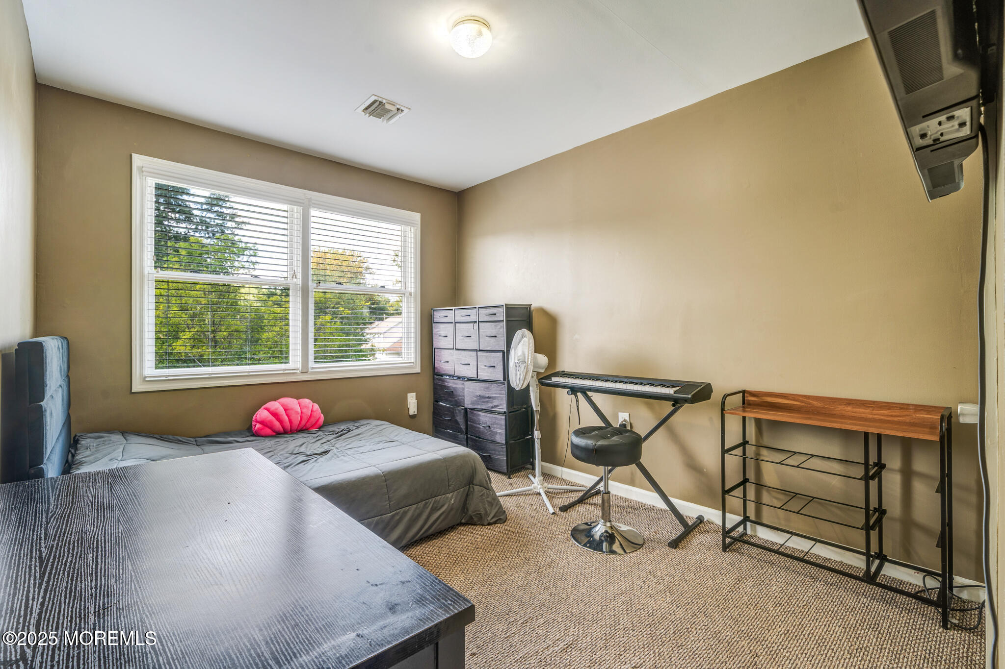 207 Delaware Avenue Cliffwood, NJ 07721 - Photo 12 of 22 a bedroom with furniture and a window