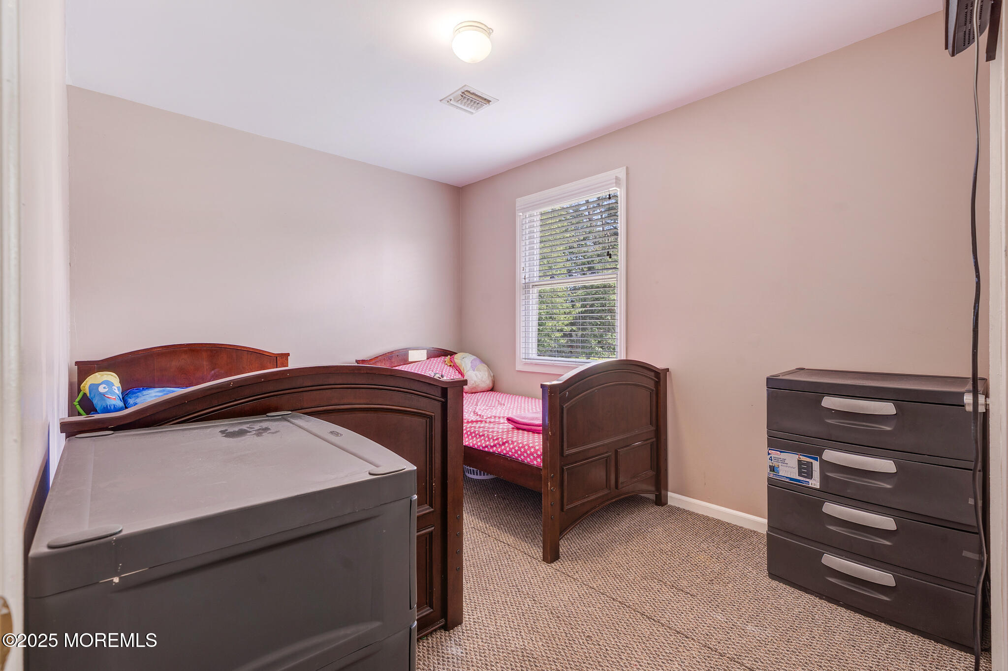 207 Delaware Avenue Cliffwood, NJ 07721 - Photo 14 of 22 a bedroom with a bed and a window