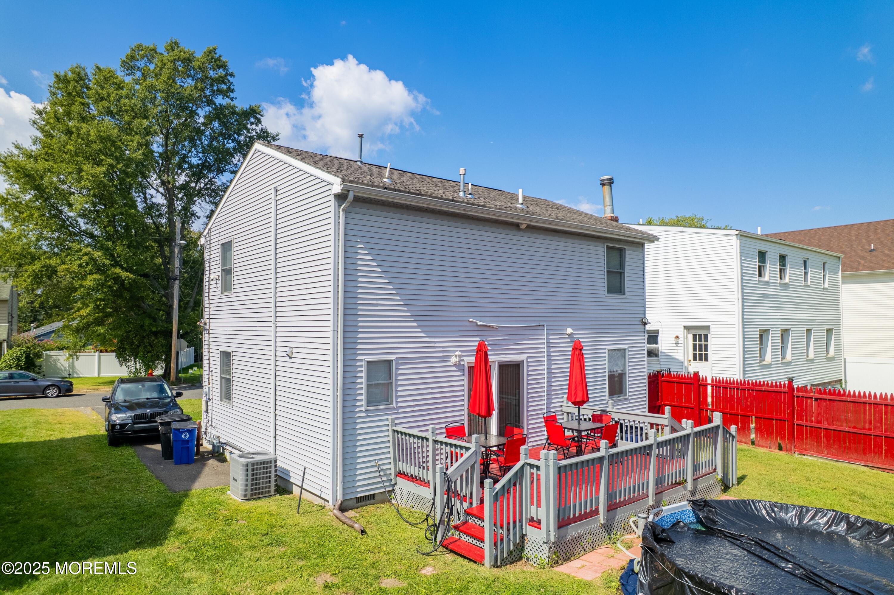 207 Delaware Avenue Cliffwood, NJ 07721 - Photo 18 of 22 a backyard of a house with seating space
