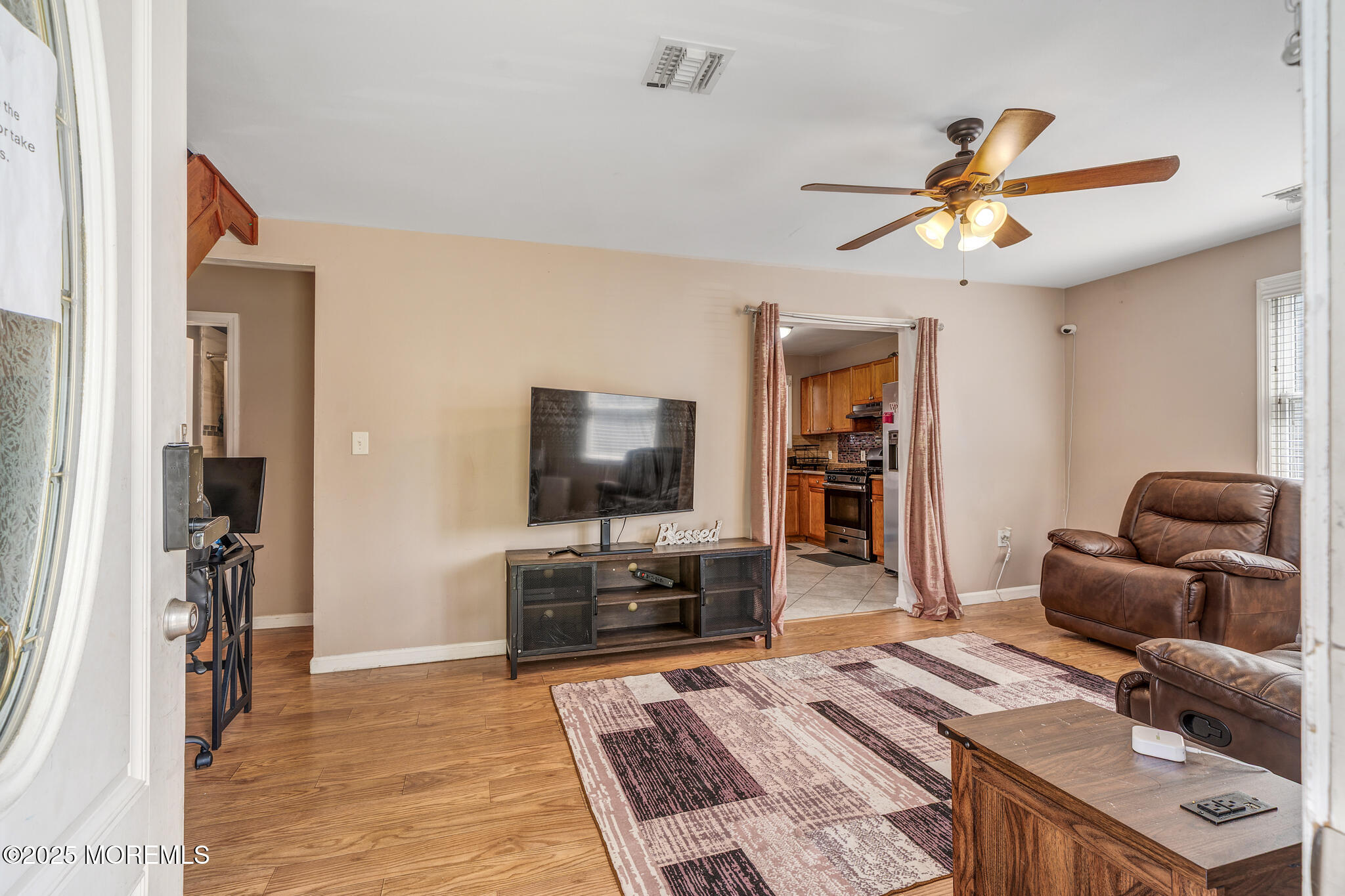 207 Delaware Avenue Cliffwood, NJ 07721 - Photo 4 of 22 a living room with furniture and a flat screen tv