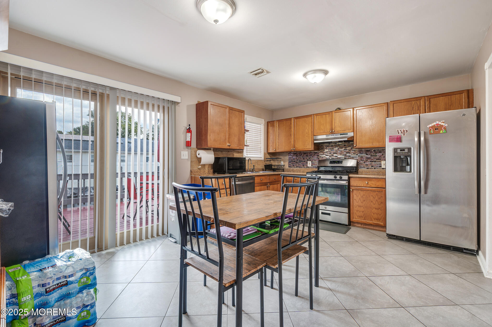 207 Delaware Avenue Cliffwood, NJ 07721 - Photo 8 of 22 a kitchen with stainless steel appliances granite countertop a refrigerator and a stove top oven