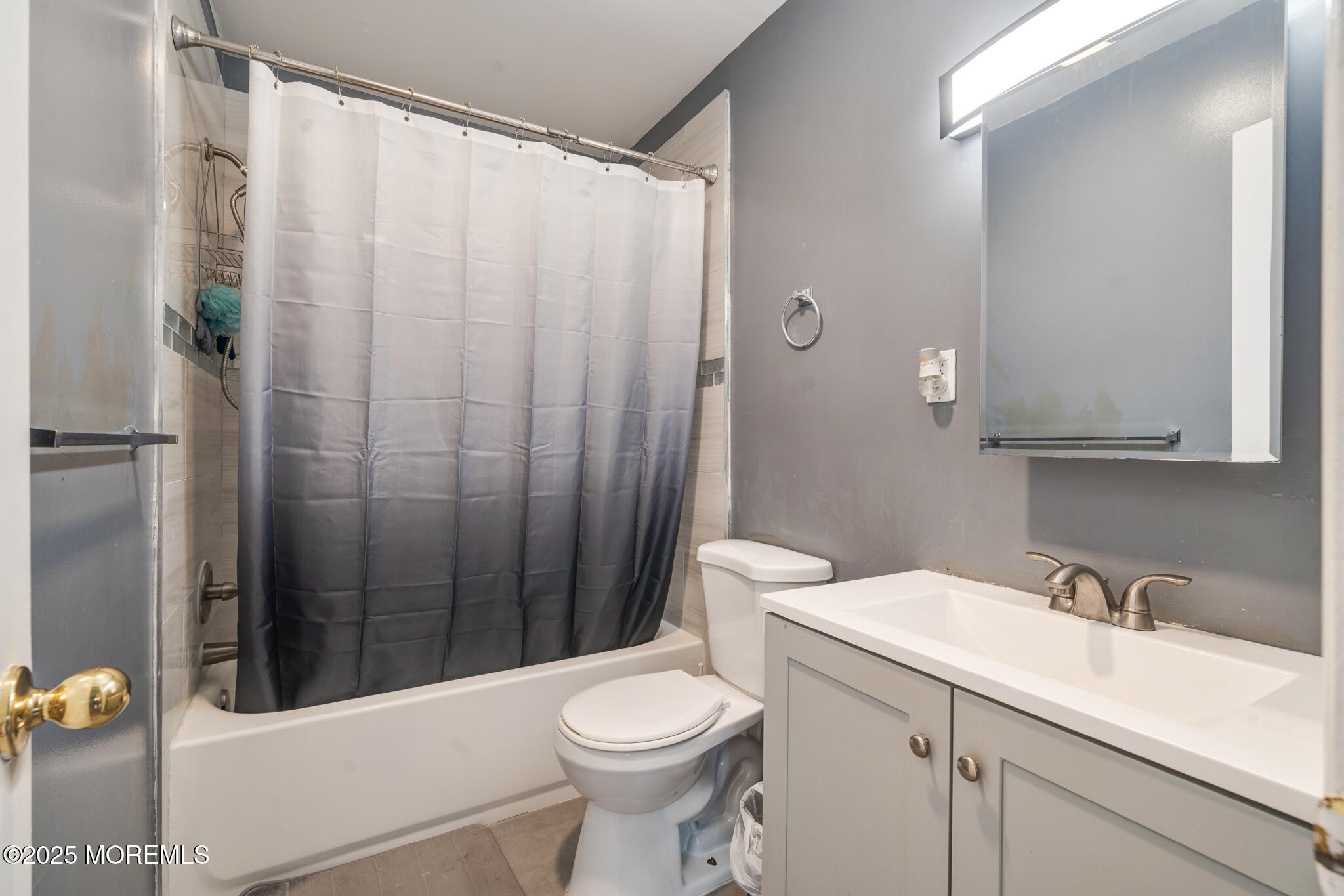 207 Delaware Avenue Cliffwood, NJ 07721 - Photo 9 of 22 a bathroom with a sink a toilet and shower