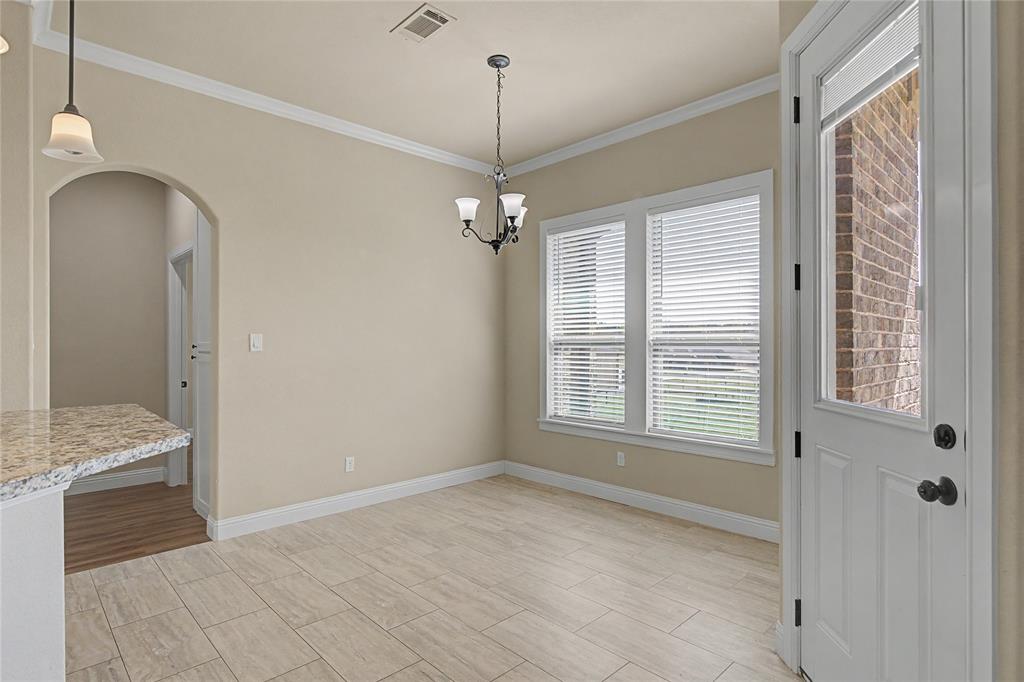 143 Wrigley Drive Springtown, TX 76082 - Photo 20 of 38 Breakfast area and access to back porch