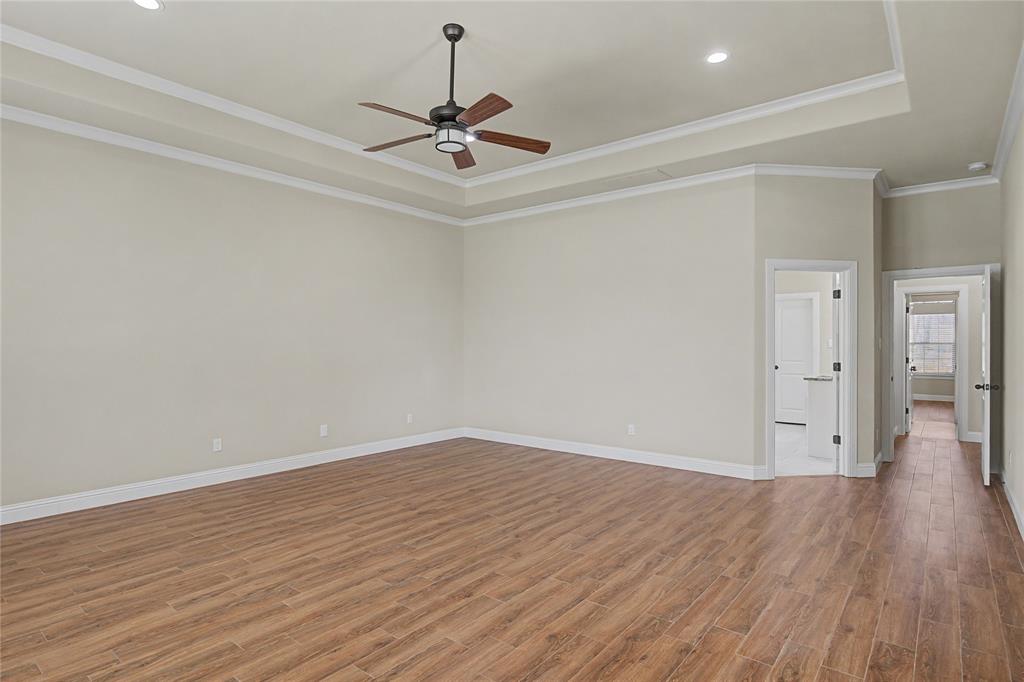 143 Wrigley Drive Springtown, TX 76082 - Photo 22 of 38 a view of an empty room with wooden floor