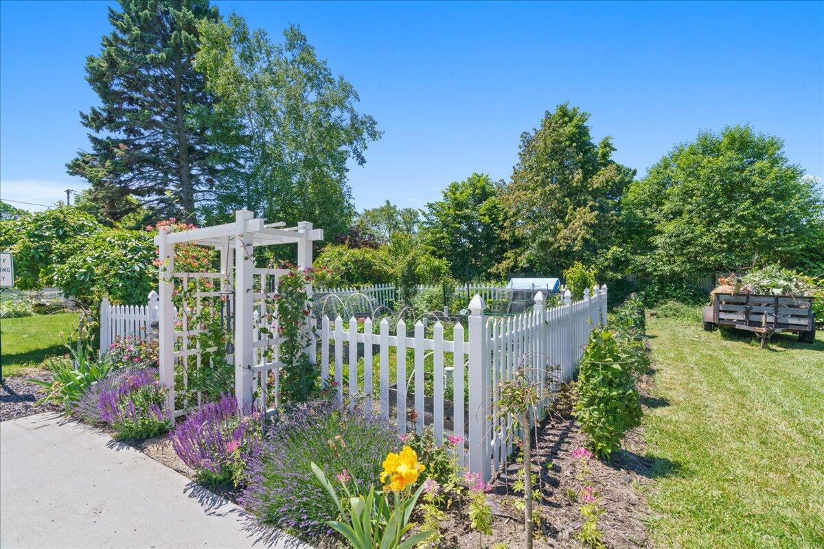 461 5th Street Manistee, MI 49660 - Photo 17 of 89 Fenced garden area with garden shed