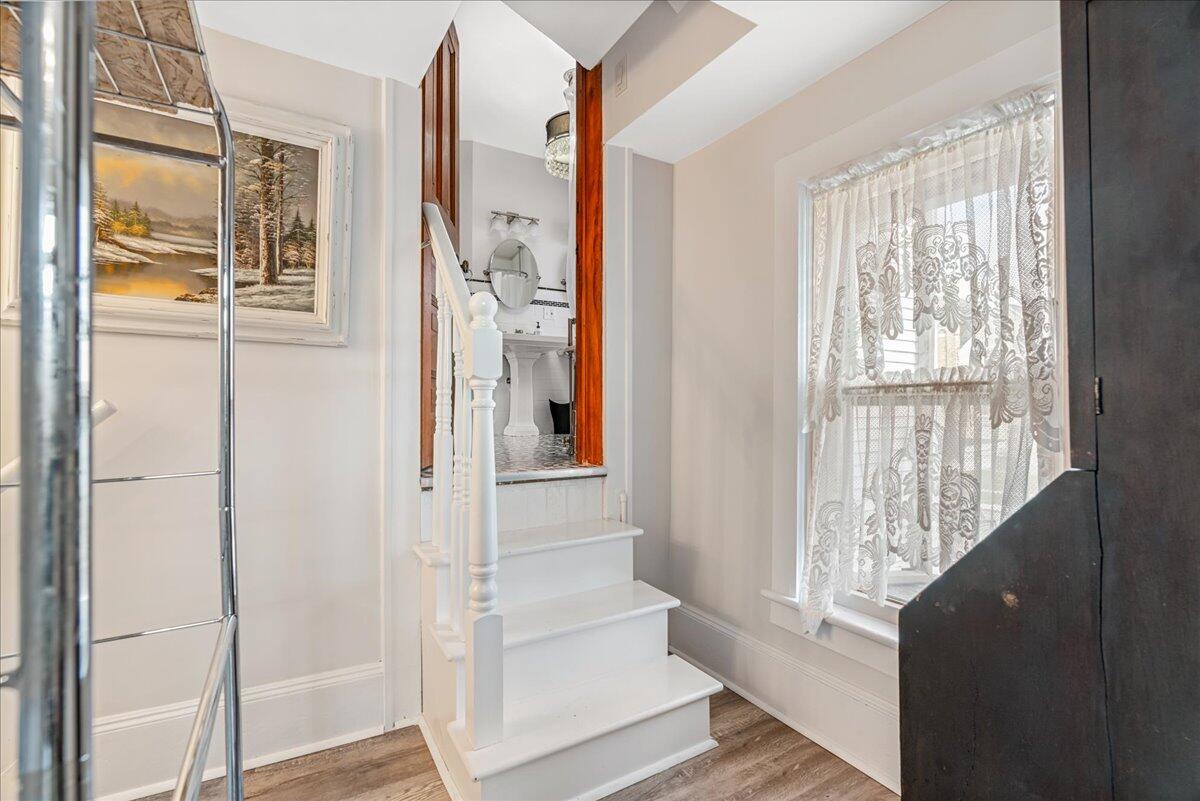 461 5th Street Manistee, MI 49660 - Photo 67 of 89 Stairs leading to bedroom 6