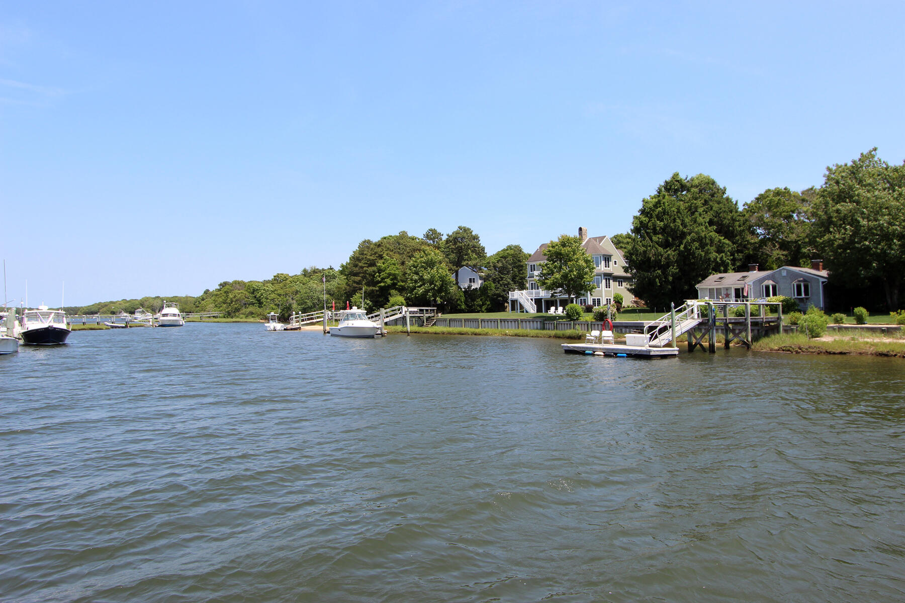 37 Riverside Road Mashpee, MA 02649 - Photo 12 of 19 a view of small lake and houses