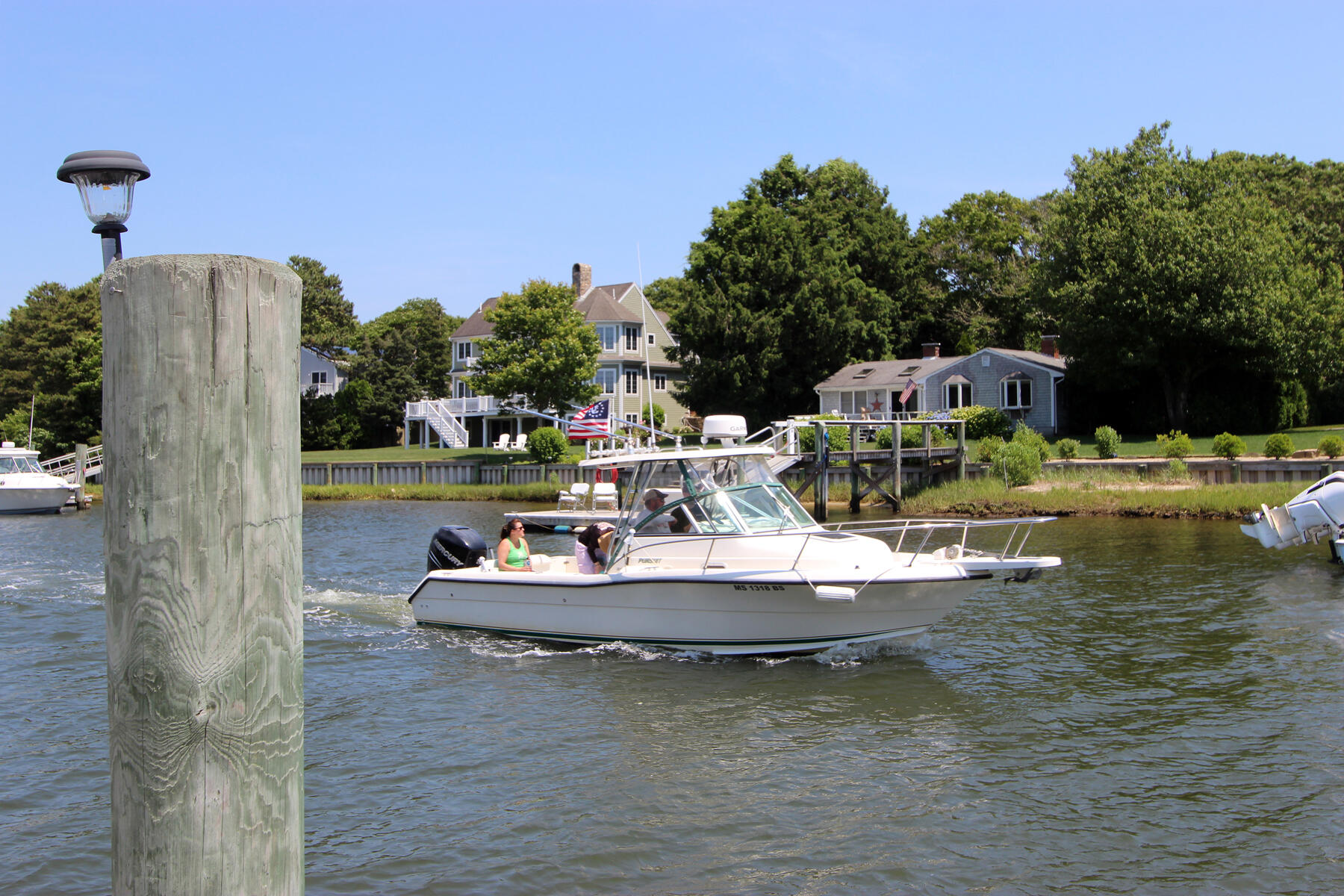 37 Riverside Road Mashpee, MA 02649 - Photo 14 of 19 a small pool with tables and chairs