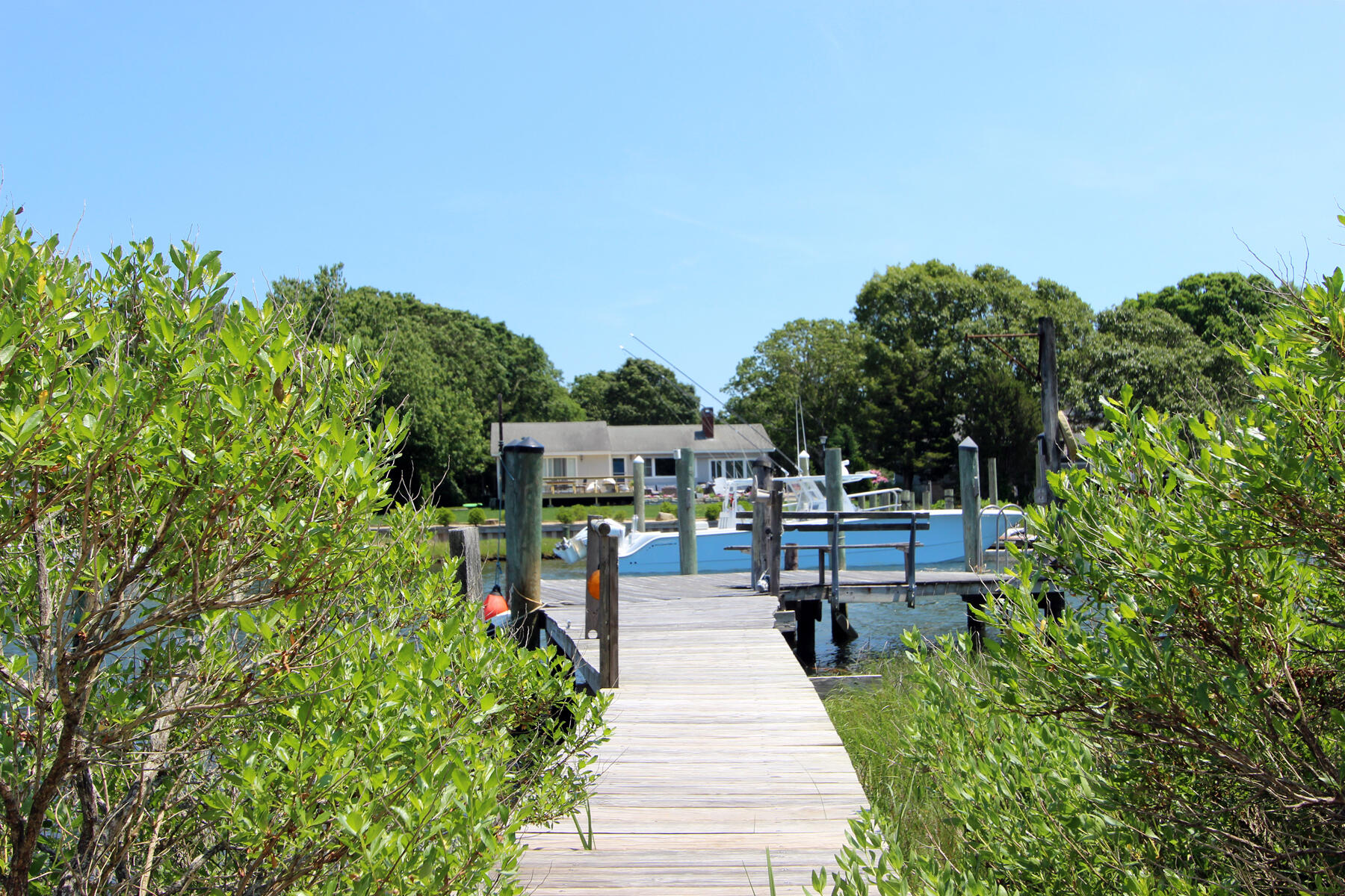 37 Riverside Road Mashpee, MA 02649 - Photo 16 of 19 a house view with a sitting space and garden