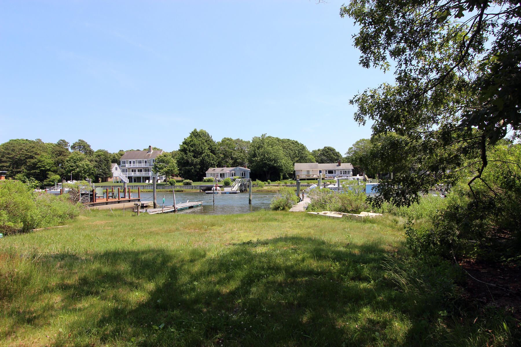 37 Riverside Road Mashpee, MA 02649 - Photo 7 of 19 a view of a swimming pool with a yard