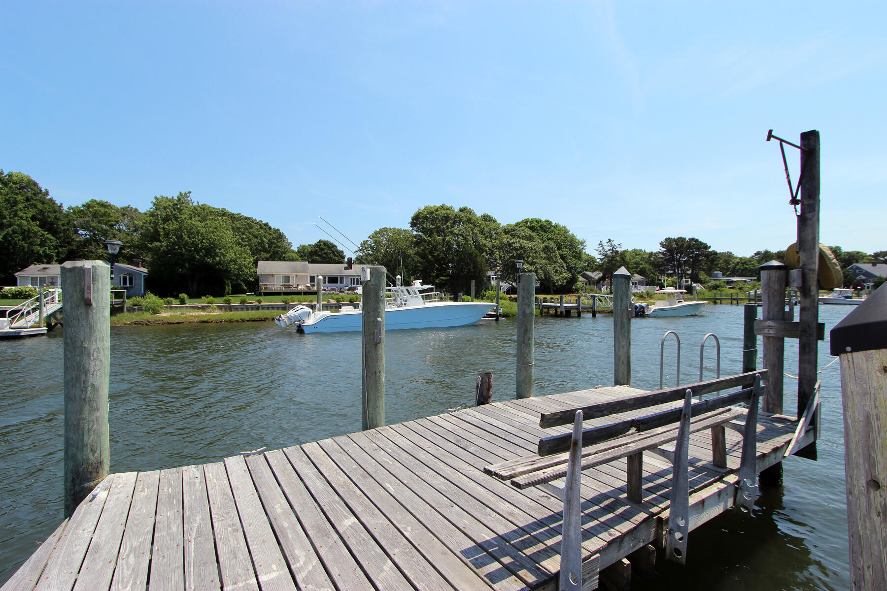 37 Riverside Road Mashpee, MA 02649 - Photo 10 of 19 a view of a lake with boats in front of it