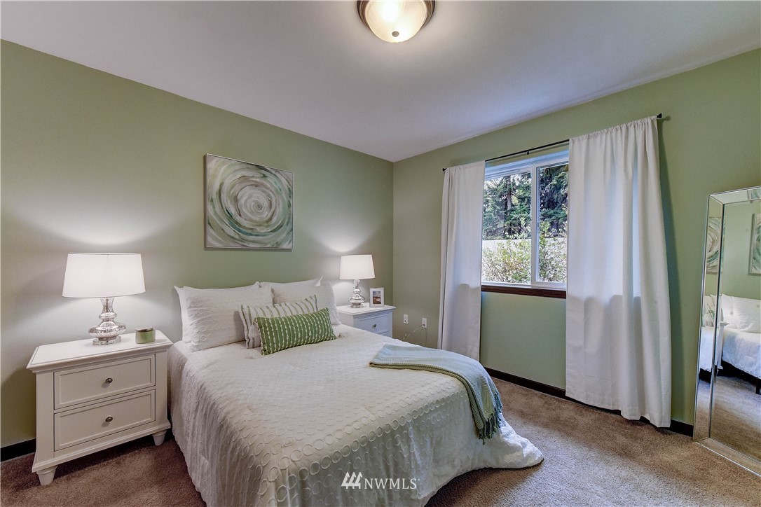 2213 239th Place Southwest Bothell, WA 98021 - Photo 14 of 25 a bedroom with a bed and a window