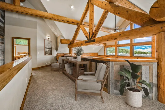 a view of a patio with table and chairs