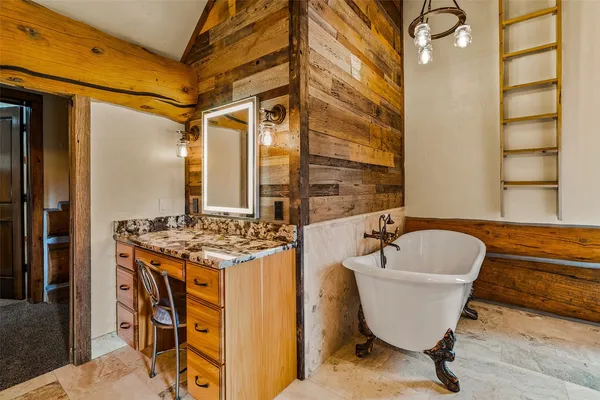 a spacious bathroom with a bathtub and shower