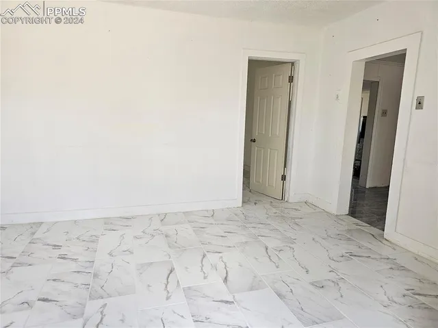 an empty room with a bench