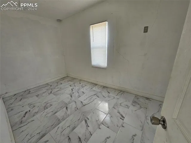 a view of a room that has a window in it